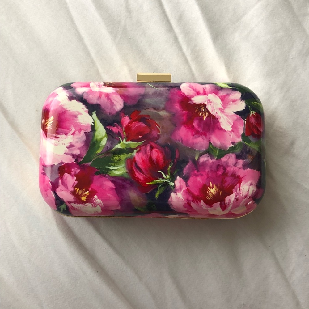 Floral hard shelled clutch. In mint condition
